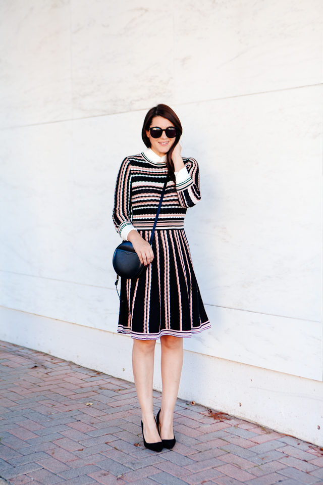 Kate Spade sweater dress with ruffle collar shirt and black cross body purse. 