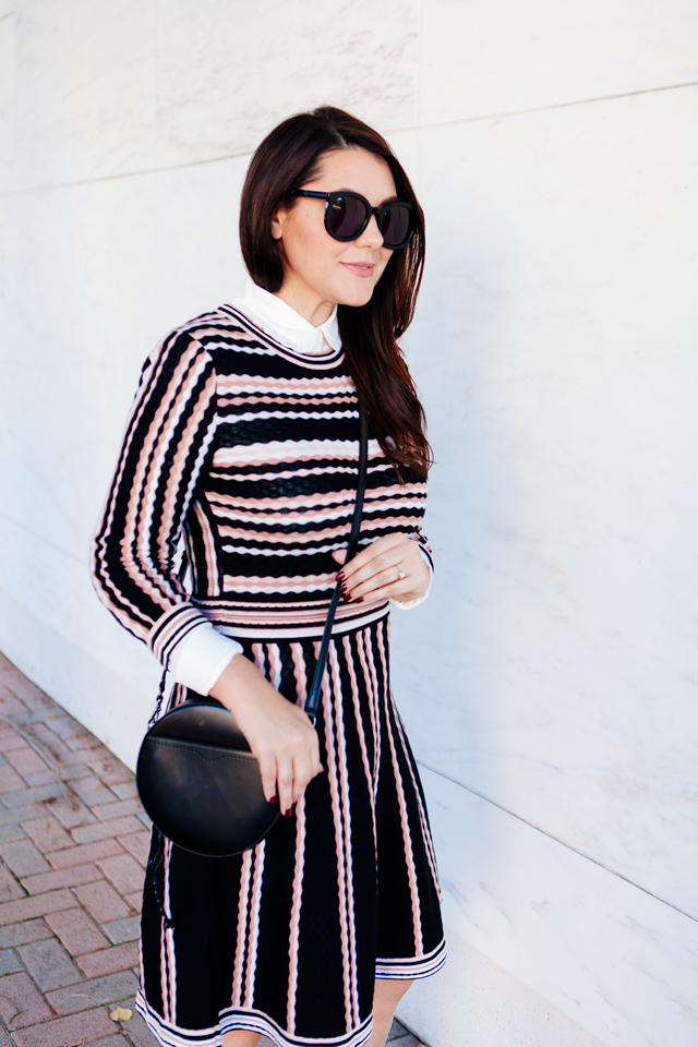 Kate Spade sweater dress with ruffle collar shirt and black cross body purse. 